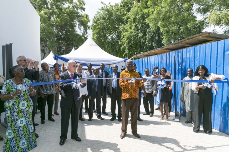 Ghana's Vice President Amissah-Arthur and USAID Assistant Administrator Linda Etim cutting the ribbon to inaugurate the building