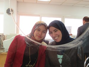 Two Port Said Tamayouz Center case agents who received customer service training through USAID follow the ‘service with a smile’