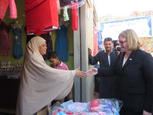 USAID/Egypt Mission Director Dr. Mary C. Ott shakes hands with one of 64 vendors at the newly-inaugurated Madinat Al Salam Marke