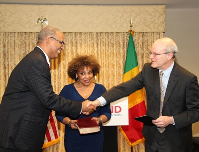 Gary C. Juste being sworn in as USAID Mission Director to Mali