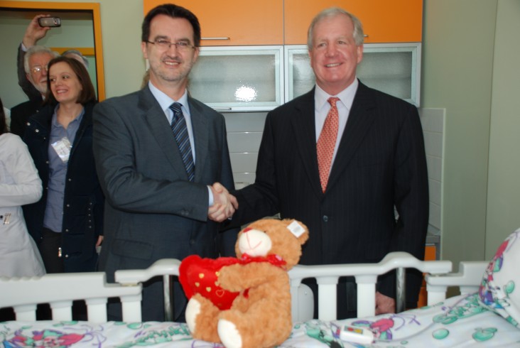 Minister of Health Dr. Ferid Agani and USAID Acting Mission Director Christopher Edwards admire the new, child friendly medical 