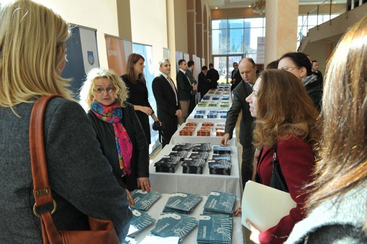 U.S. Charge d’Affaires (center, right)) Kelly Degnan admires exhibits at the local governance conference in Pristina.