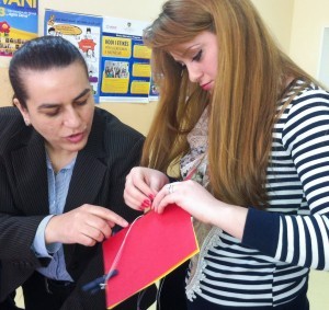 Teachers learning to bind books