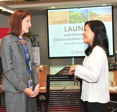 Carrie Thompson, Acting-Director, USAID Regional Development Mission for Asia (left) speakes to Maria Theresa Medialdia, Program