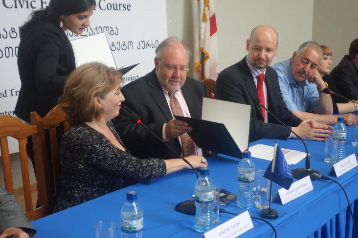 Mission Director Stephen M. Haykin signs MOU.