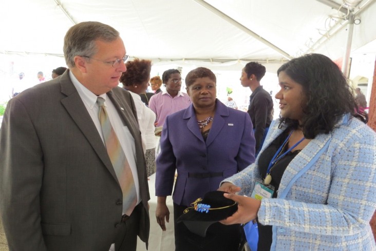 Mission Director Christopher Cushing (left) and Yolande Forde, learn more about the ‘Butterfly Project'