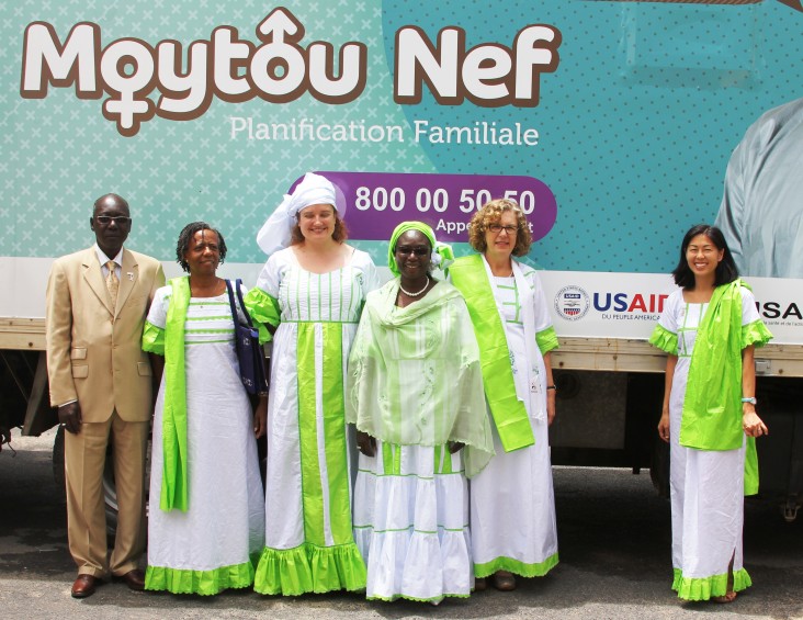 Ms. Clark is shown here in front of a new family planning mobile clinic with USAID Acting Mission Director Alfreda Brewer