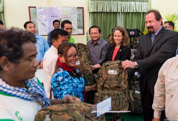 Mission Director Polly Dunford handed over forest patrol equipment to members of Prey Lang Community Network and Prey Lang Forest Community Network.