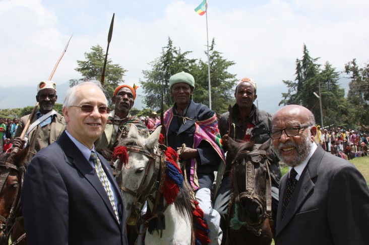 U.S. Ambassador Donald Booth (l) and Project Mercy Co-founder Deme Tekle-wold with local residents in a Gurage celebration.