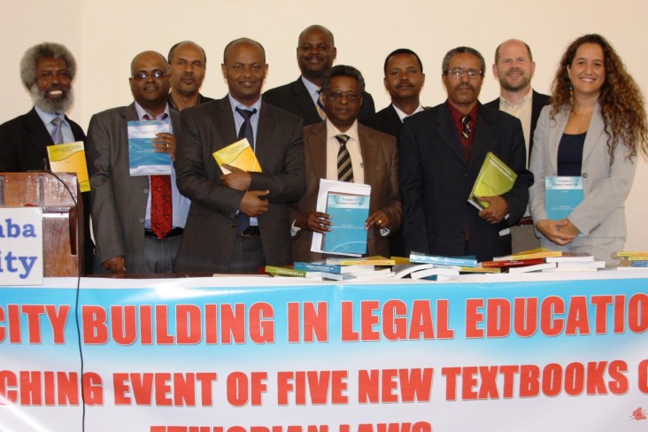 USAID, American Bar Association and AAU officials join the authors of the new law books.