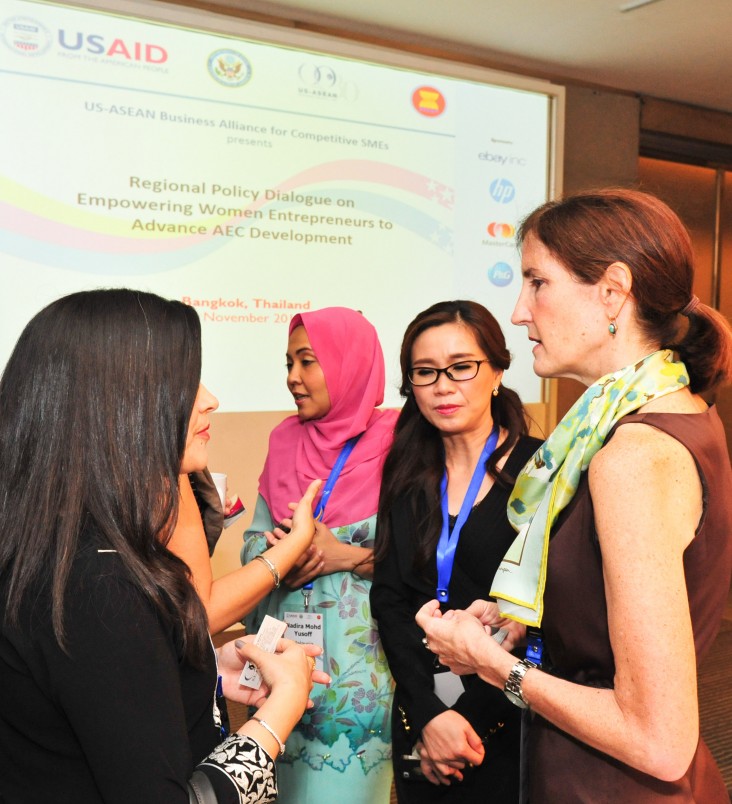 Acting Mission Director Carrie Thompson talks with participants at the Regional Policy Dialogue on Empowering Women Entrepreneur