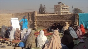 A group of women elders from Qasam Abad village, Behsud District, meet to discuss women's role in dispute resolution and to form