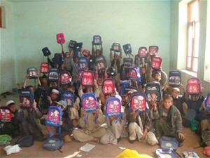 School children at the Babrak School in Paktya display their new backpacks.