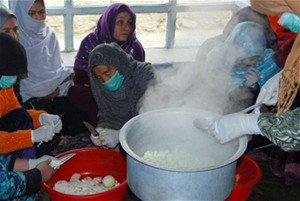 Khanom Ghul prepares mixed vegetable pickles at a food processing training organized by the Afghan Women’s Business Council (AWB