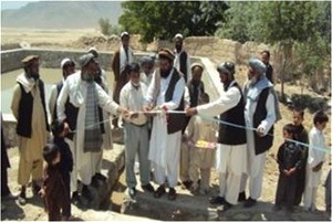 Community elders participate in the irrigation project closing ceremony.