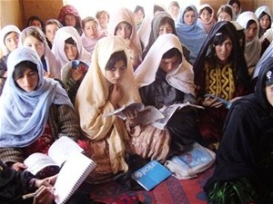 Women learn to read in a literacy class established by the community development council.