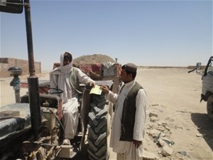 A local entrepreneur purchases a tractor-load of the soil separated from the hundreds of thousands of cubic feet of solid waste 