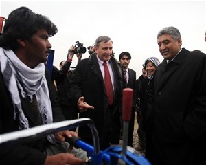 U.S. Ambassador Karl W. Eikenberry and Minister of Agriculture, Irrigation and Livestock Mohammad Asif Rahimi meet with a farmer