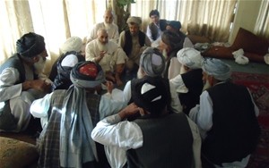 Tribal elders involved in dispute resolution meet with Shah Mohammad Khan, the district governor of Arghandab District, to discu