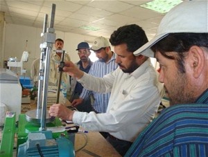 Engineer Mohammad Ashraf, manager of the Kabul Central Laboratory, demonstrates one of the quality control instruments employed 