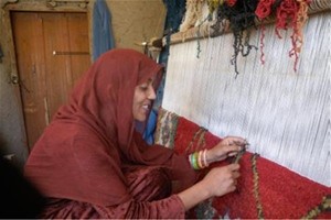 Women in eastern Afghanistan like Musharaba are now enjoying newfound confidence and skills in carpet weaving and literacy thank