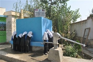 AFTER Now the schoolgirls can drink or wash at an array of taps set into a tank that holds water supplied by the new solar pump.