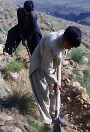 Eighteen-year-old Abdul Khaliq helps terrace a hillside in Nurguram, Nuristan Province.