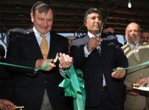 U.S. Ambassador Karl W. Eikenberry (left) and Minister of Agriculture, Irrigation and Livestock Asif Rahimi cut the ribbon to op