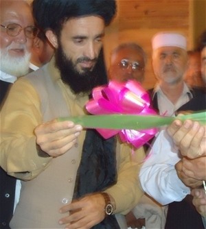 The deputy of Nangarhar provincial council (center) and other government representatives cut the ribbon to open the Jalalabad Ci