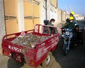 Zarangas pick up trash from one of Mazar-e-Sharif’s neighborhoods.