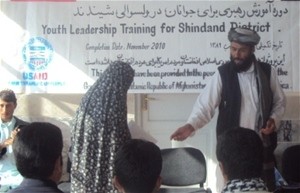 Shindand District Governor, Lal Mohammad Omarzai hands out certificate during the closing ceremony in October 2010.