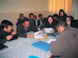 Budding playwrights review their scripts at the USAID Writing for Radio Workshop in Kabul.