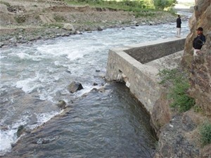The rehabilitated Karaste Canal channels water to low-lying farms and sloping and upland fields in Tagab District, spurring agri