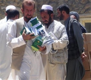 Community Cultural Center volunteers distribute information about access to justice, legal rights, and women's rights in Parwan 