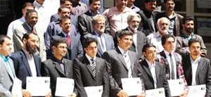 New managers at the Herat Medium Taxpayer Office display their certificates after completing a USAID-funded management training 