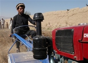 Shah Mohammed demonstrates his family’s new two-wheel tractor. The tractor will enable Mohammed and his five brothers to cultiva