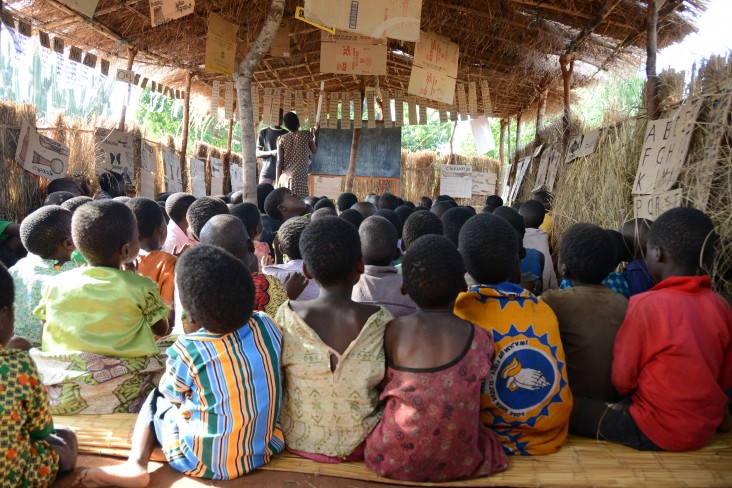 A volunteer teacher discusses the letter “n” at an after-school reading camp in Mbeti, Malawi.