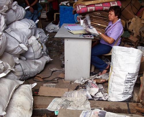Josefina De Leon pores over the evidence following a warehouse raid and inventory of confiscated marine products in Zamboanga Ci