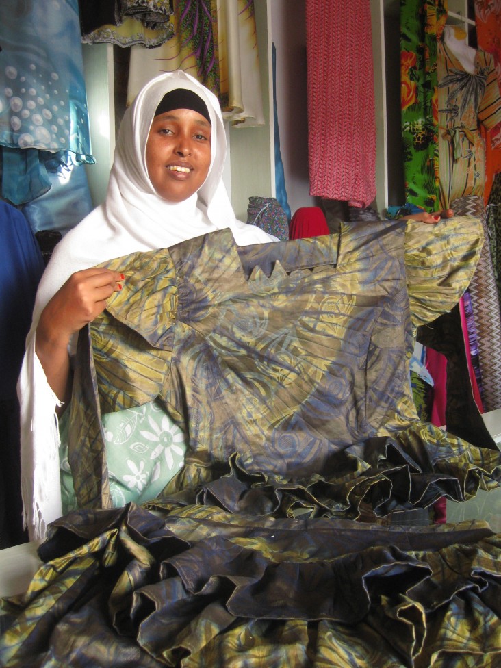 Qani Abdi Alin, the founder of Dheeman Enterprise, shows off one of her designs.