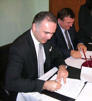 Signing the first commercial loan to a local government unit in Albania.