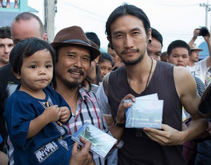 The lead singer of Thailand’s most popular band, BodySlam, poses for pictures with fans in Udon Thani, Thailand.