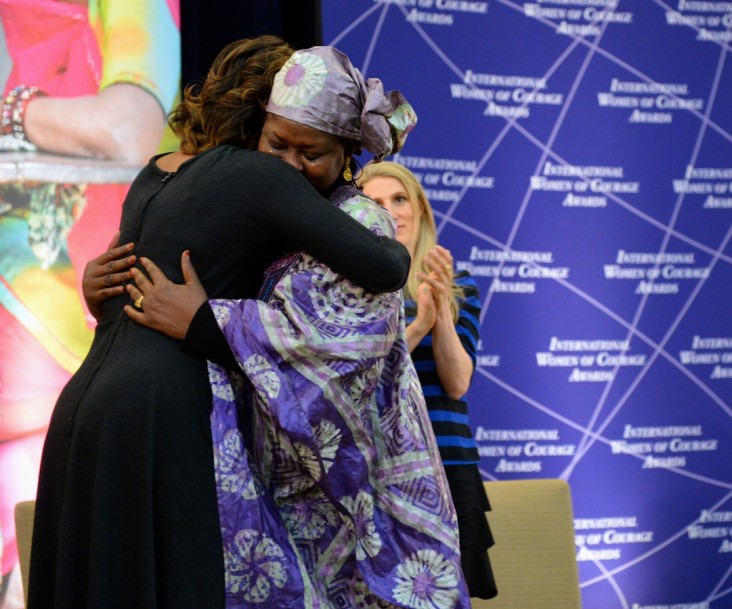 Fatimata Touré and Michelle Obama embrace during the 2014 International Women of Courage Award Ceremony.