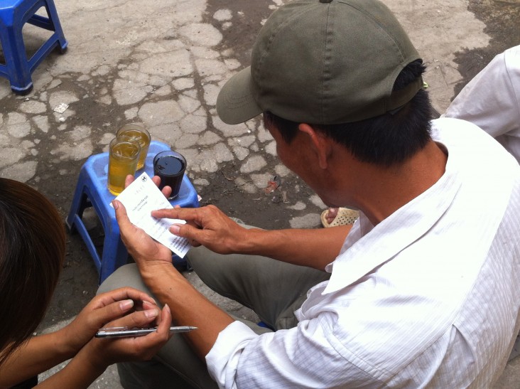 A client receives an HIV testing and counseling referral from community-based supporter in Hanoi.