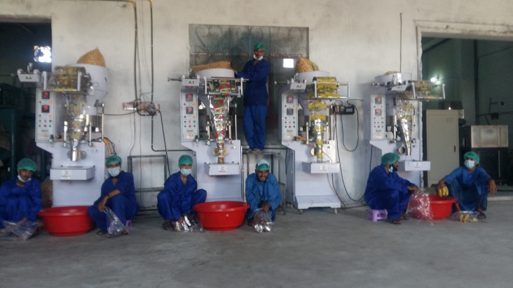 Sail Food Company workers use the new packing machines 