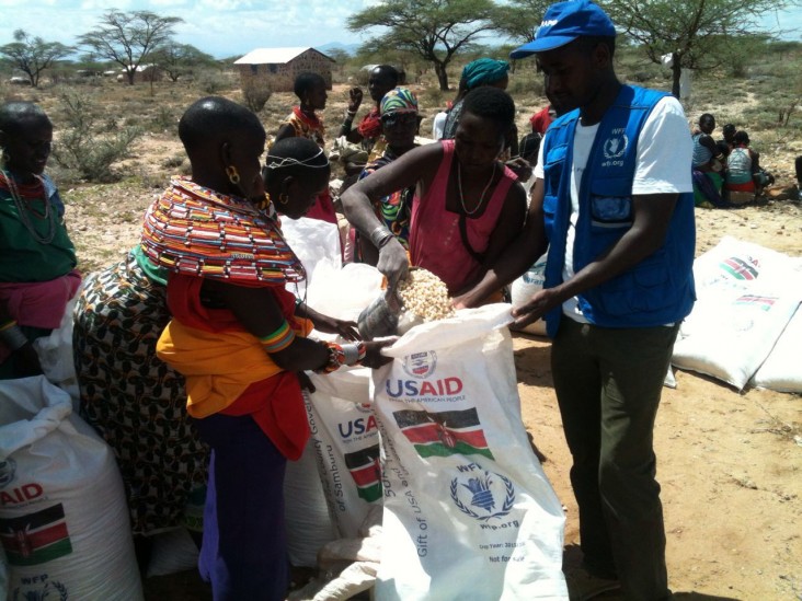 Women from Samburu County assist at a food distribution with help from UN World Food Program (WFP) staff. 
