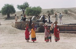 Residents fill up at a harvesting structure, which has made water readily available for drinking, agriculture and sanitation dur