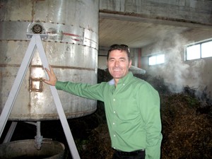 Xhevit Hysenaj, owner of Xherdo Medicinal Plants and Essential Oils near Durres, Albania, beams proudly next to the essential oi