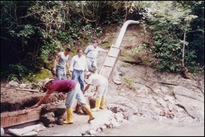 Workers make improvements to an aqueduct system for the municipality of Tello in Colombia.
