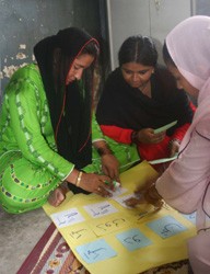 A lab technician examines samples for suspected TB in Karachi