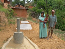 This family in Kaski, a mountainous region of central Nepal, benefited from a USAID program installing multi-use water systems. 